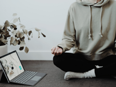 laptop and person in yoga pose