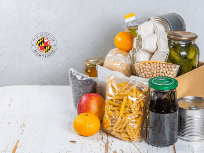 pantry items such as fruit, pasta, umd logo on wall