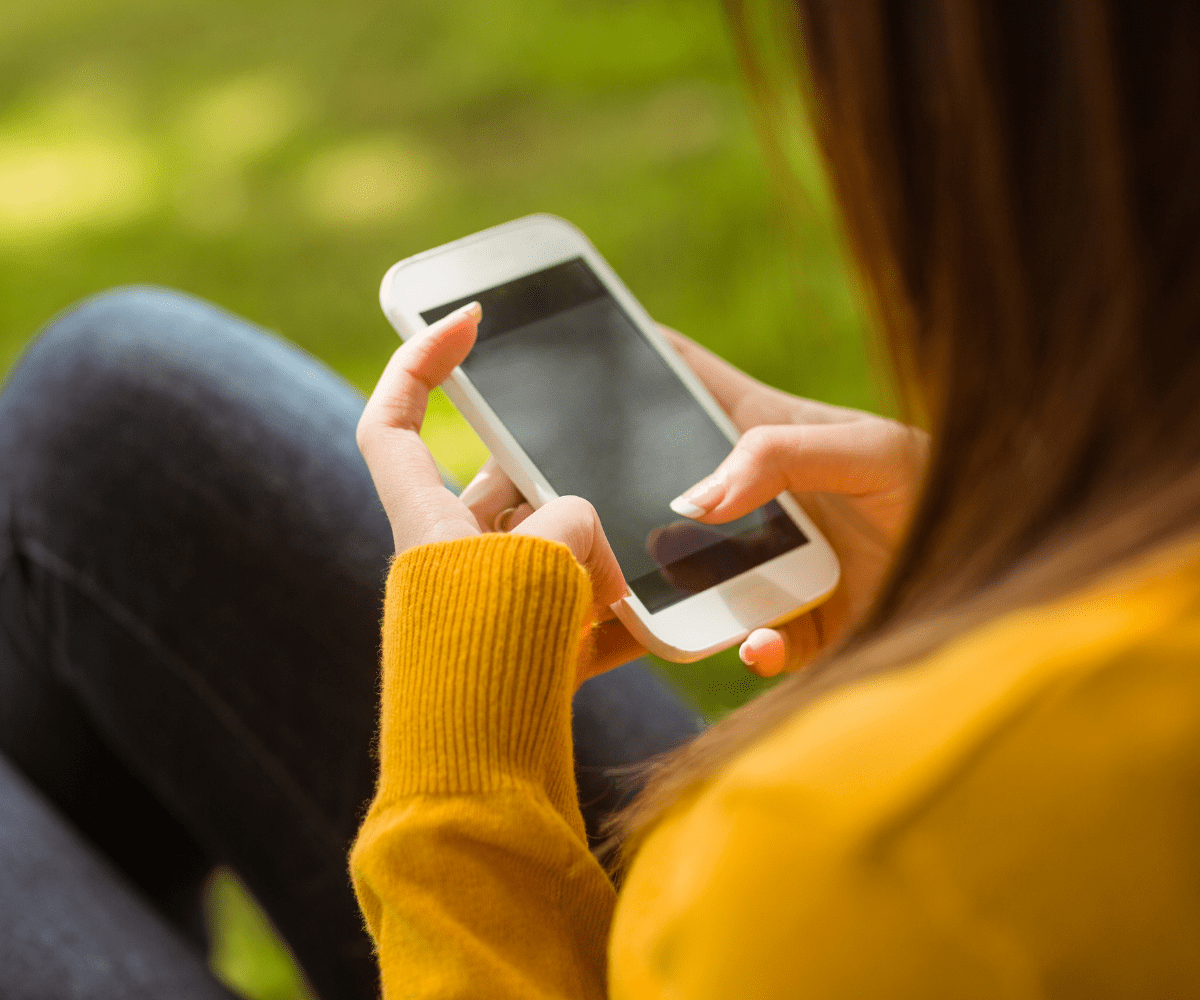 woman holding cellphone