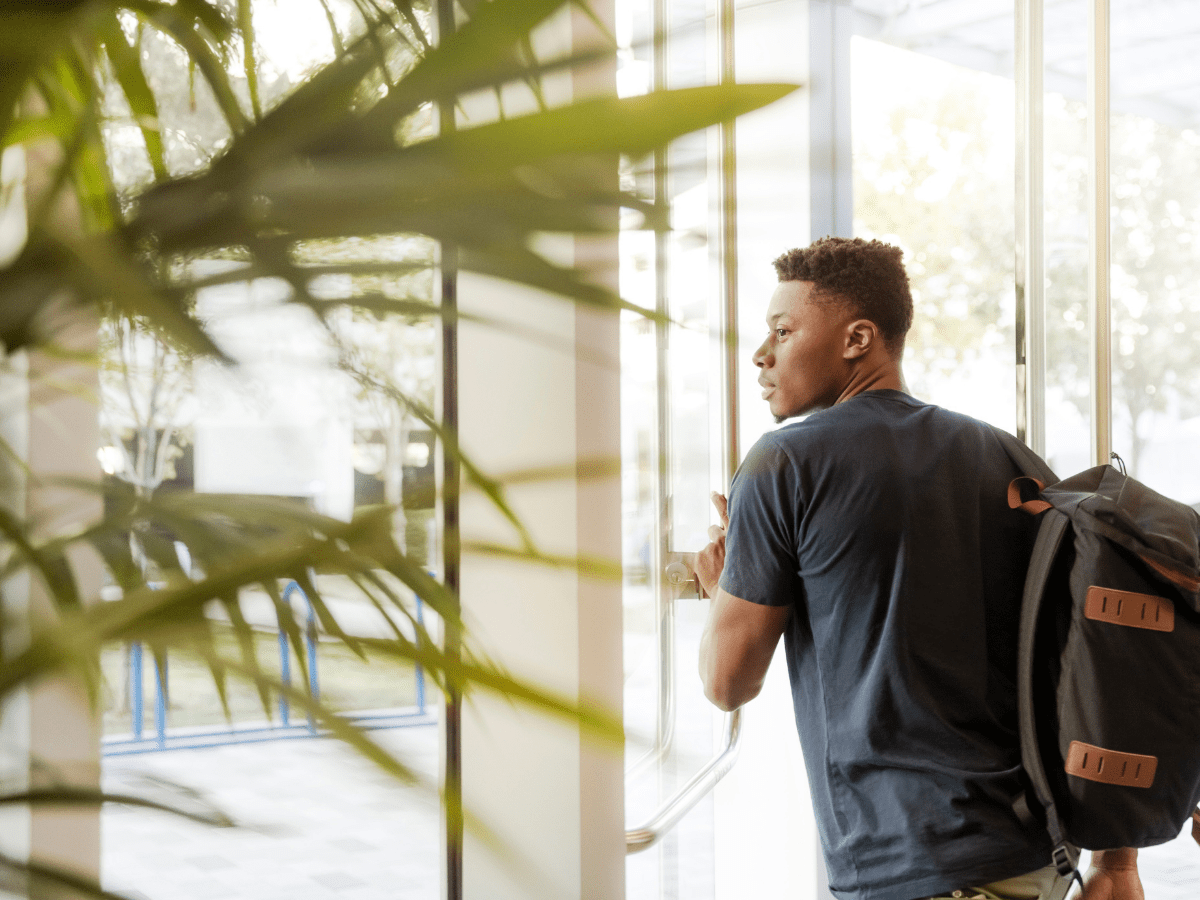 student opening door